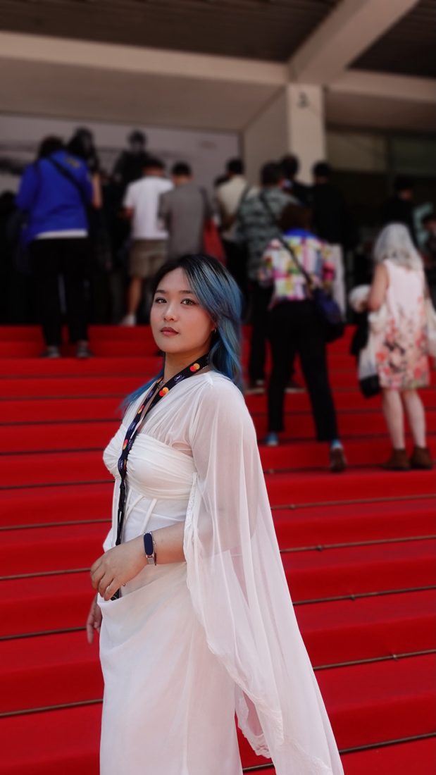 Ekon on the red-carpet steps at Cannes